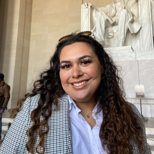 Pic of Mercedes smiling, the Abraham Lincoln monument is behinder her, cropped